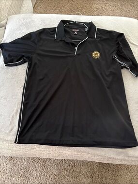Antigua Black Polo with White Piping and Boston Bruins Emblem